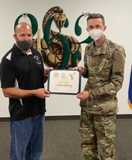 Trent Sweeney Receiving Air Force training completion certificate 